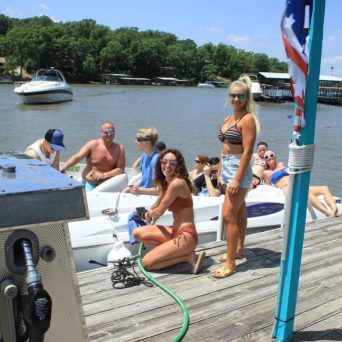 a group of people in a boat on a body of water