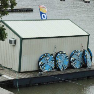 a boat that is sitting on the side of a building