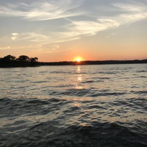a sunset over a body of water