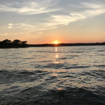 a sunset over a body of water