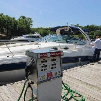 a boat sitting on top of a car