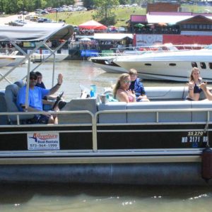 a group of people on a boat in the water