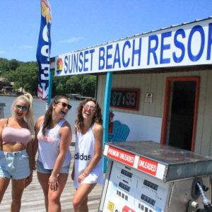 a woman standing in front of a sign
