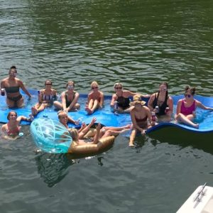 a group of people swimming in a body of water