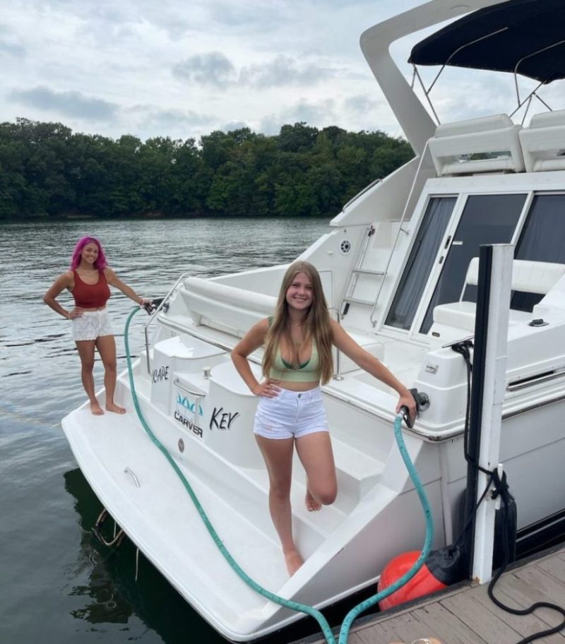 a person standing on a boat in the water