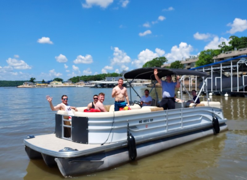 dads and sons a group of people in a small boat in a body of water
