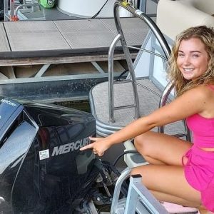 a woman sitting on a boat