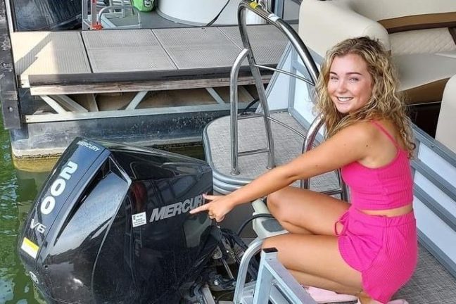 a woman sitting on a boat