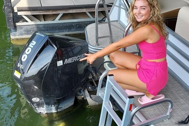 a woman sitting on a boat