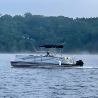 a small boat in a large body of water