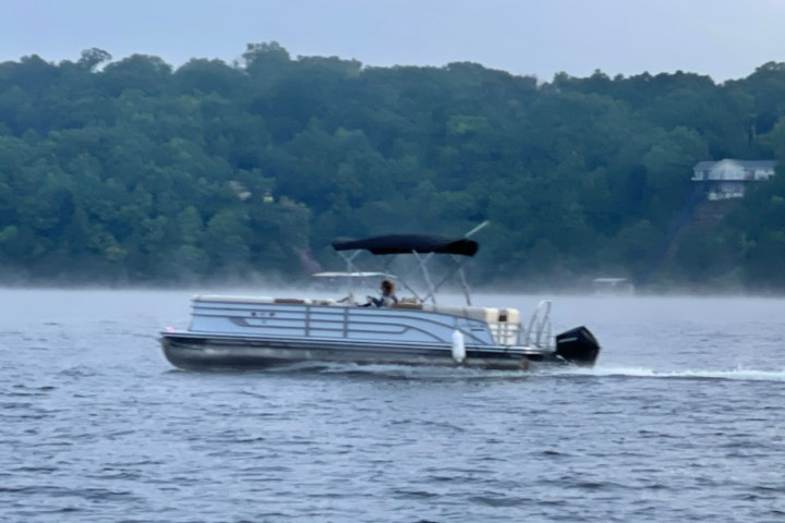 a small boat in a large body of water